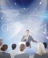 Composite image of businessman doing speech during meeting