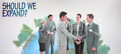 Composite image of business people shaking hands