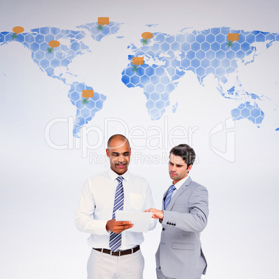 Composite image of businessmen working together