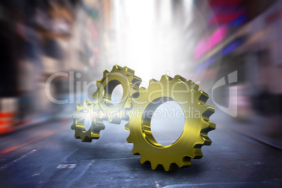 Composite image of metal cog and wheel connecting