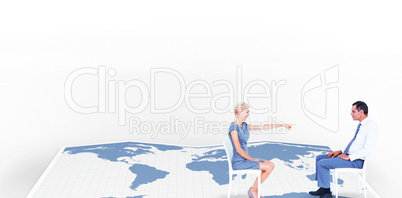 Composite image of businesswoman pointing at businessman