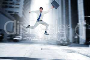 Composite image of cheerful jumping businessman with his suitcas