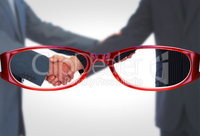 Composite image of handshake in agreement