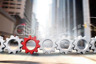 Composite image of red and white cogs and wheels