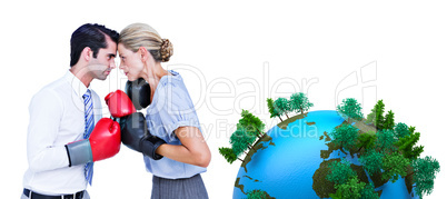 Composite image of business people wearing and boxing red gloves