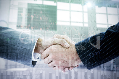 Composite image of business people shaking hands