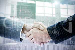 Composite image of business people shaking hands