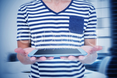 Composite image of close up of man holding tablet