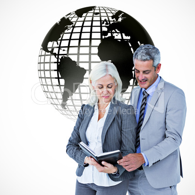 Composite image of  smiling businesswoman and man with a noteboo
