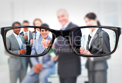 Composite image of businessman opening a bottle of champagne to