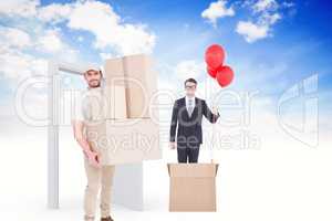 Composite image of delivery man carrying cardboard boxes