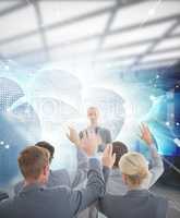 Composite image of business team raising hands during conference