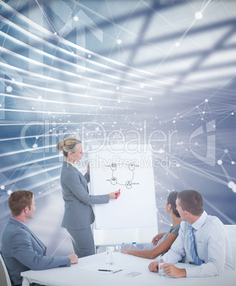 Composite image of manager presenting whiteboard to his colleagu