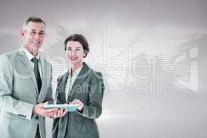 Composite image of business team using tablet pc