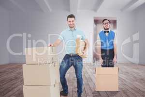 Composite image of courier man with cardboard boxes