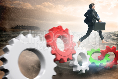 Composite image of businessman jumping