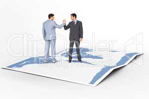 Composite image of businessmen shaking hands