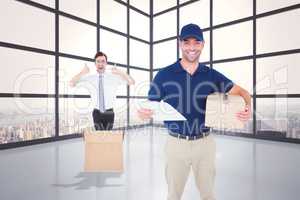 Composite image of happy delivery man with cardboard box and cli