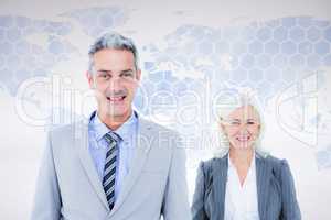 Composite image of  businessman and businesswoman smiling at the