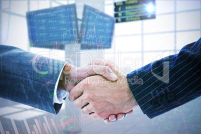 Composite image of business people shaking hands