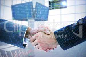 Composite image of business people shaking hands