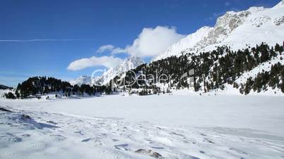Clouds passing by at frozen Austrian lake Obersee