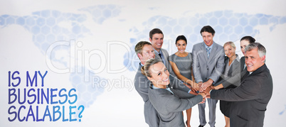 Composite image of smiling business team standing in circle hand