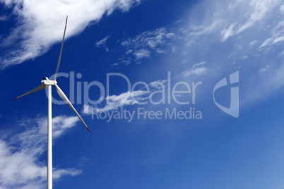 Wind turbine and blue sky with clouds