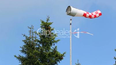 Wind vane in front of blue sky