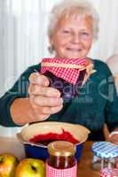 Granny proudly displays her homemade jam