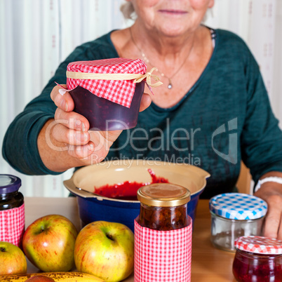 Granny proudly displays her homemade jam