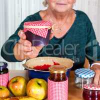 Granny proudly displays her homemade jam
