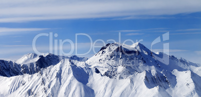 Panoramic view on winter mountains in haze