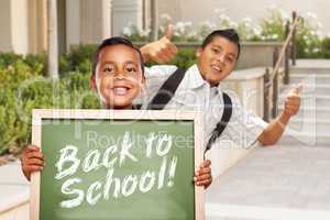 Boys Giving Thumbs Up Holding Back to School Chalk Board