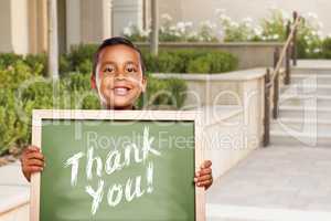 Hispanic Boy Holding Thank You Chalk Board on School Campus