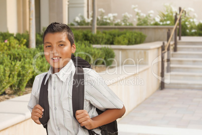 Happy Hispanic Boy with Backpack Walking on School Campus