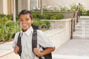 Happy Hispanic Boy with Backpack Walking on School Campus