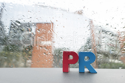 Word PR. Wooden letters.