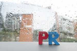 Word PR. Wooden letters.