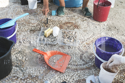 Archaeologists recover artifacts mosaic.