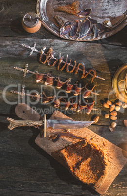 Dried meat on wooden table