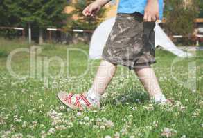 Child walking on the meadow