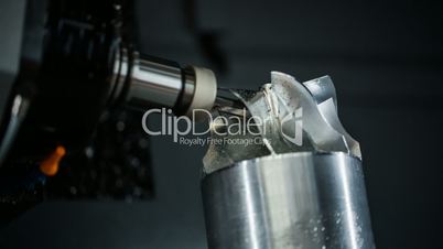 Metalworking CNC milling machine. Cutting metal modern processing technology. Small depth of field. Warning - authentic shooting in challenging conditions. A little bit grain and maybe blurred.