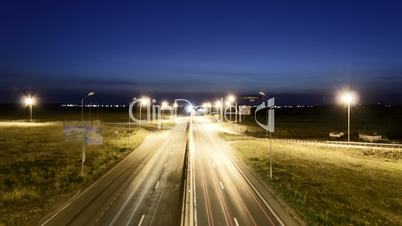 Speed Traffic at Sundown Time - light trails on motorway highway at night