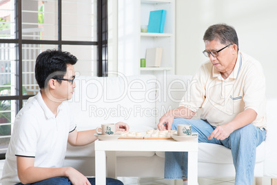 Family Playing Chinese Chess