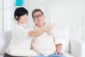 Senior using smart phone making selfie