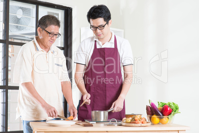 Father and son cooking