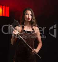 beauty woman maniac with ax in hand on grid background