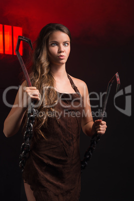 beauty woman with hooks in hand on gray background