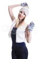 happy blond girl in hat and mittens on a white background